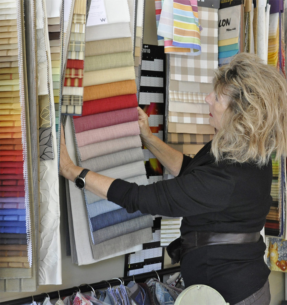 anita murray interior designer choosing fabrics for client